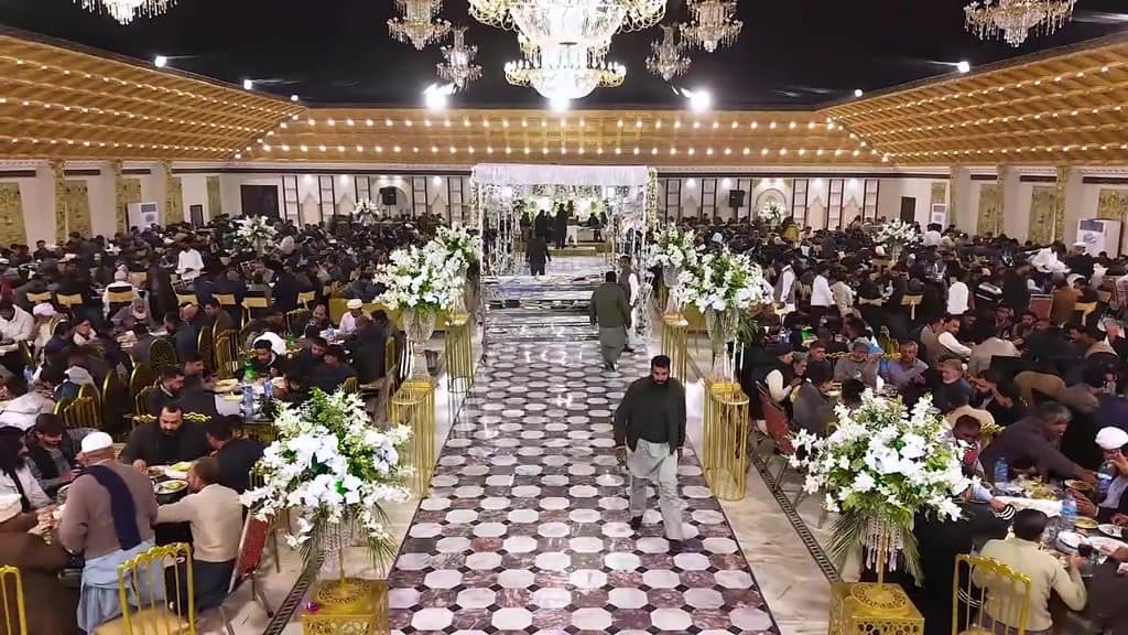 Banquet hall with guest tables arranged for table-service dining